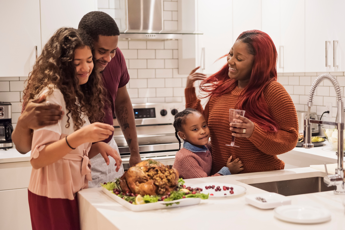 Family preparing Thanksgiving dinner.